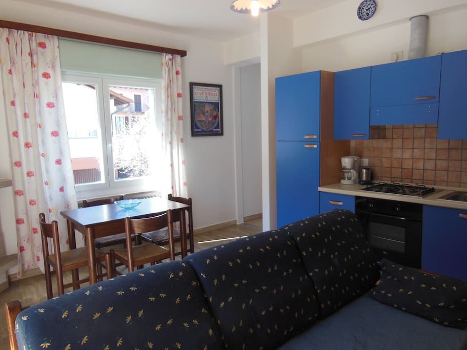 livingroom with kitchen and table