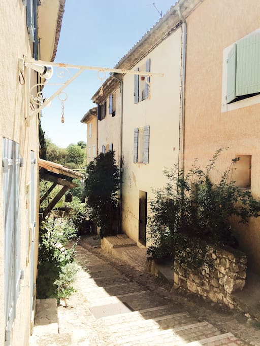 This is our street, the studio is on the ground floor of the house with blue shutters