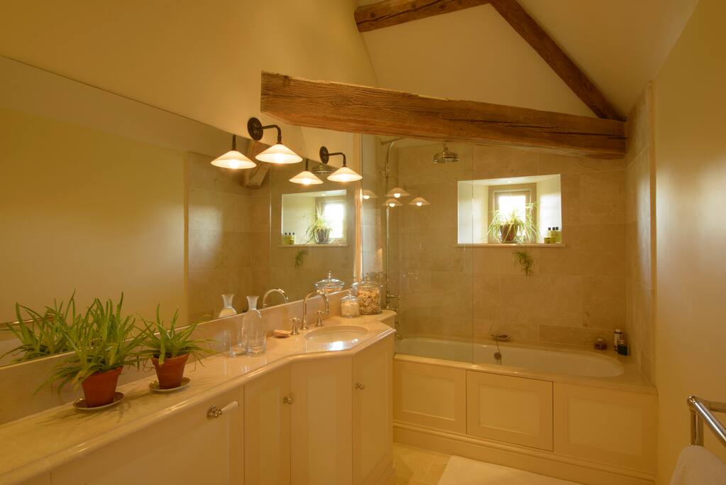 French Room's en suite bathroom with shower over bath.