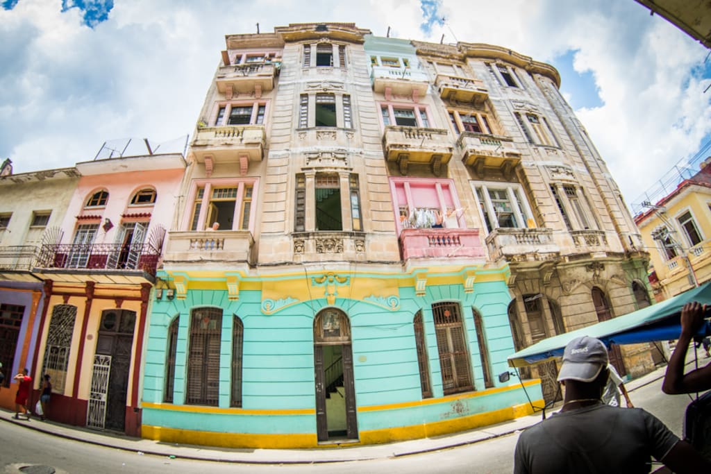 Our building (turquise and yellow) our balcony is the the second one up on the right (above the pink one with the laundry)