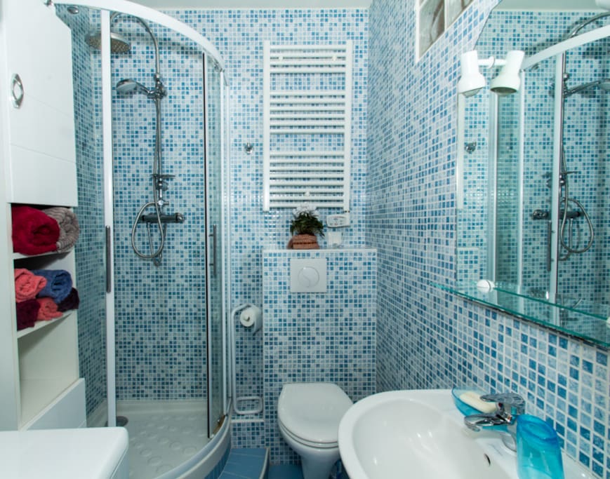 Bathroom with shower and combination washer/dryer