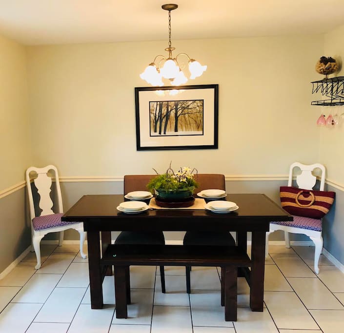 dining room and fully furnished kitchen with breakfast nook