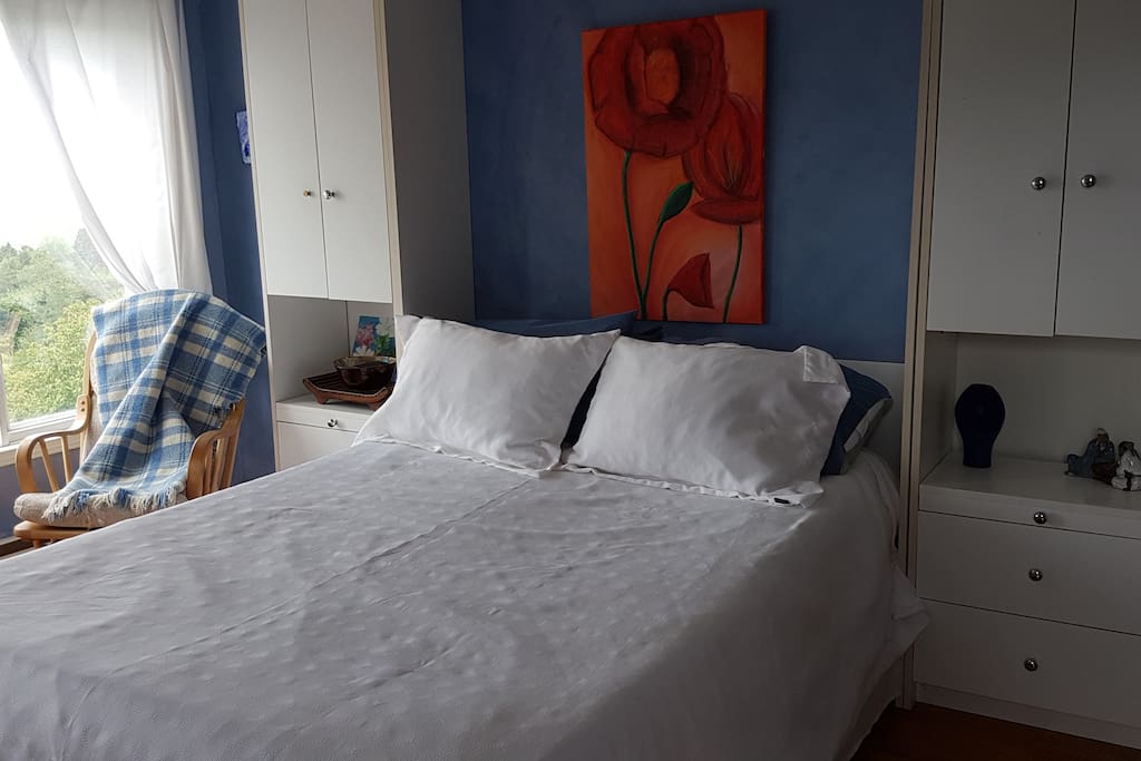 Bedroom 2 - large room with queen bed and separate small deck overlooking the river.
