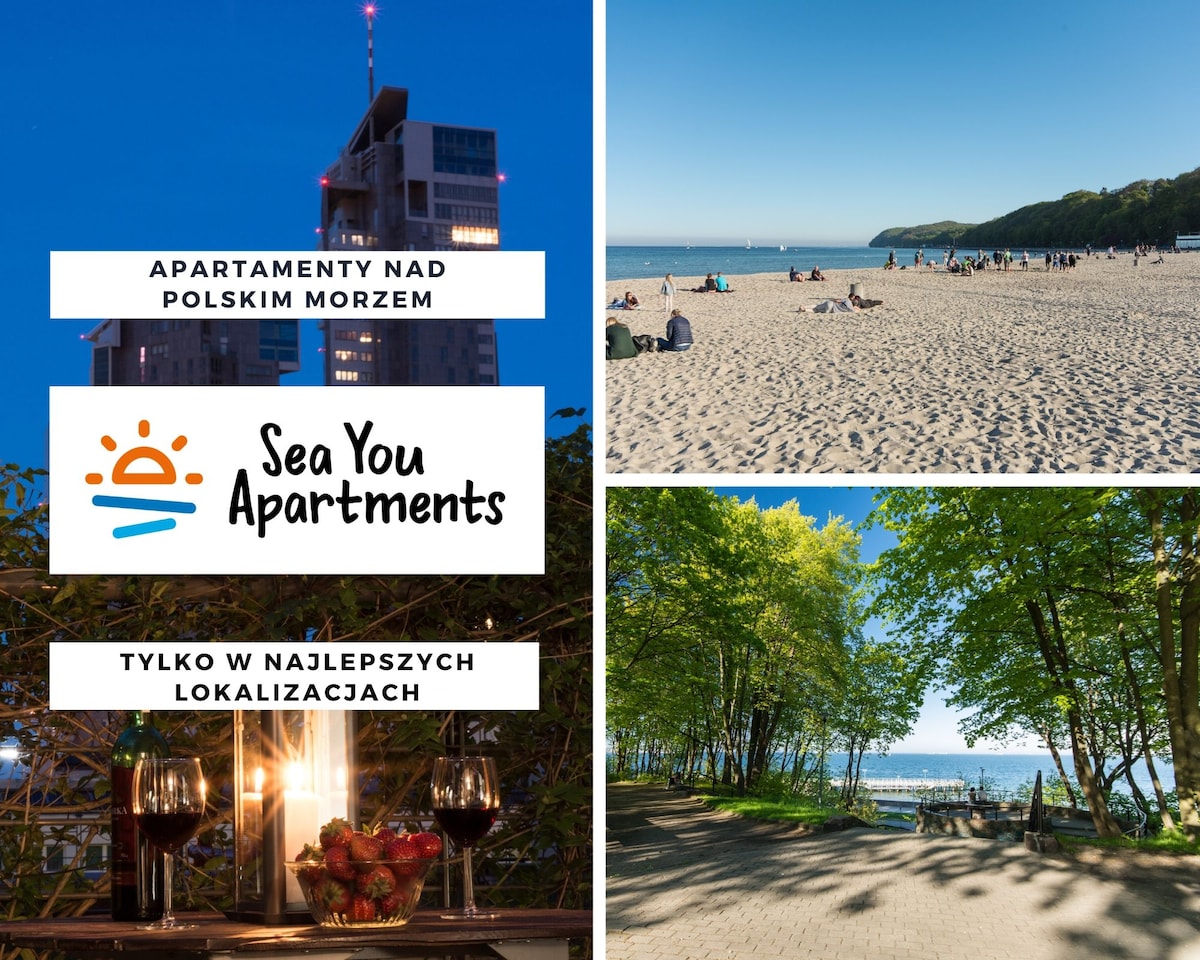 A vibrant scene features a sandy beach under blue skies, with visitors enjoying the shoreline. The left side showcases a modern building illuminated against the evening sky. The right presents a tree-lined pathway leading toward the beach, inviting leisurely walks.