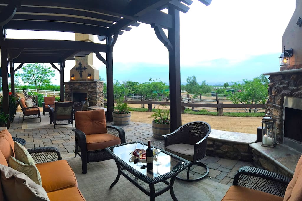 Villa patio & fireplaces overlooking the ranch and vines.