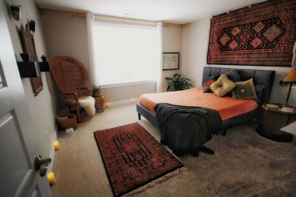 Electric candles and Kashmir rugs from India give the room its unique style