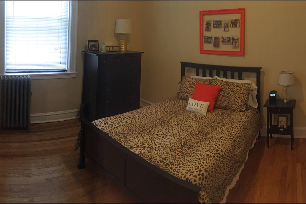 Full-sized bed in bedroom.