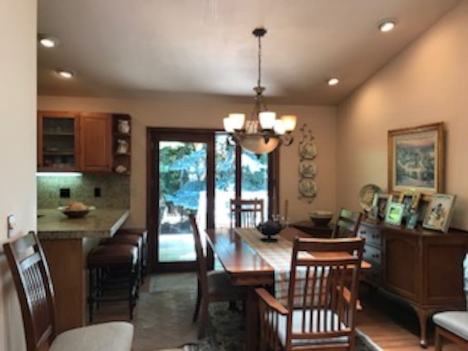 Dining Room with Access to Balcony with BBQ and steps to yard