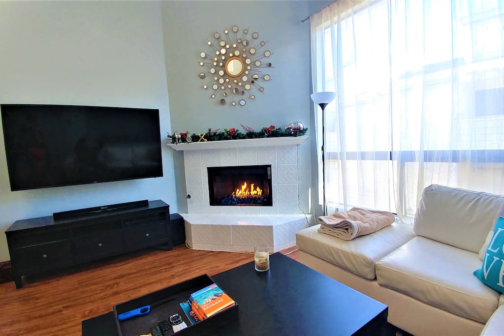 65in TV and cozy fireplace