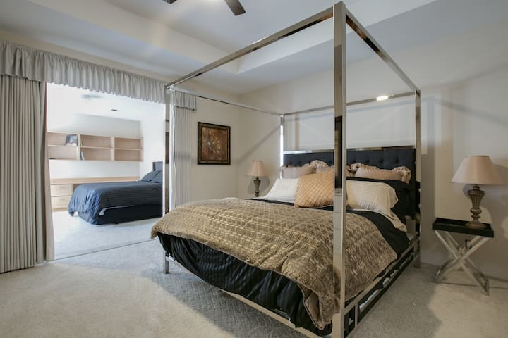 Bedroom 1 and bonus room.with his & her closets including 1 walk-in.