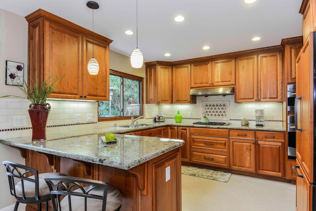 Breakfast Bar & Kitchen, with sliding glass door to deck