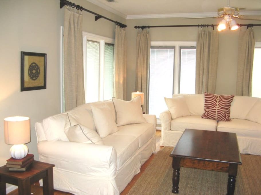 Large great room with comfortable living area and TV with DVD player