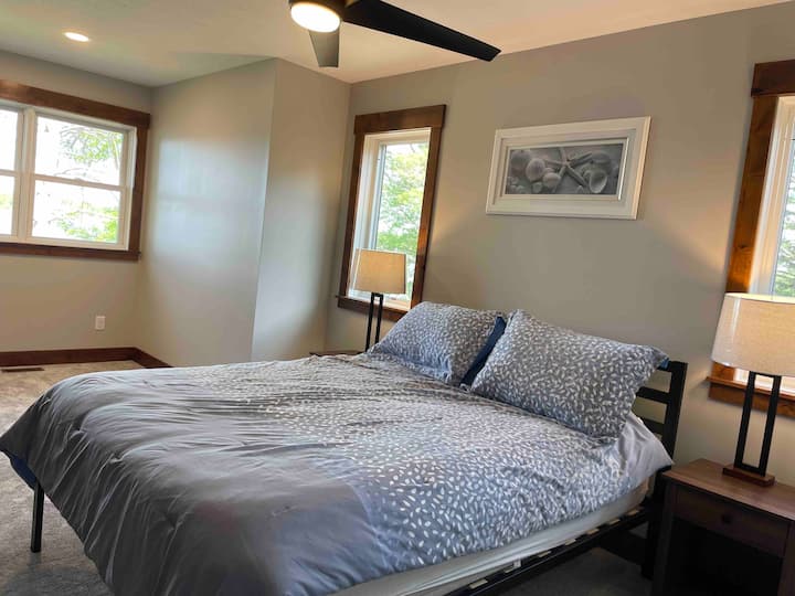 Upper level Bedroom 3 with queen bed and lake views 