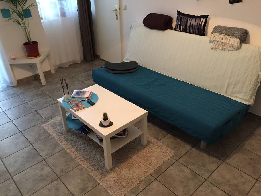 Living room with sleeping couch (Ikea)