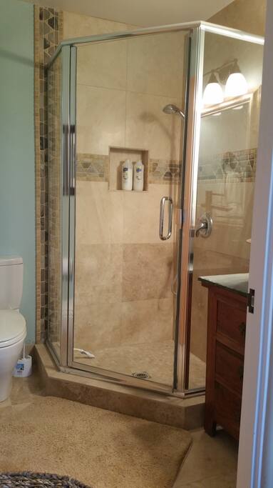 Beautiful custom travertine and slate tile shower.