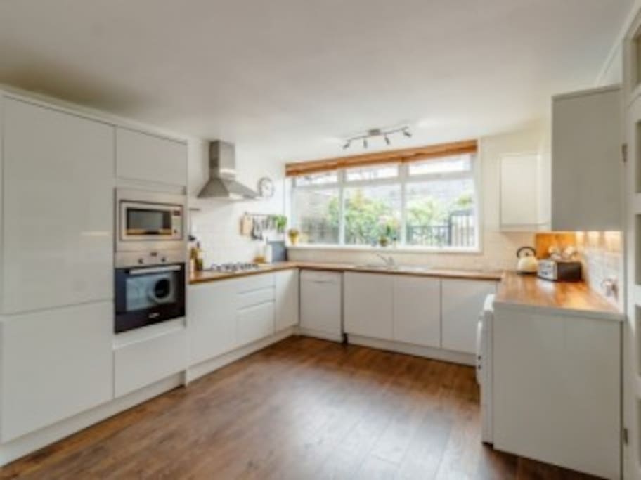 Kitchen has gas hob, electric oven, microwave, fridge freezer, dishwasher and washer/dryer.