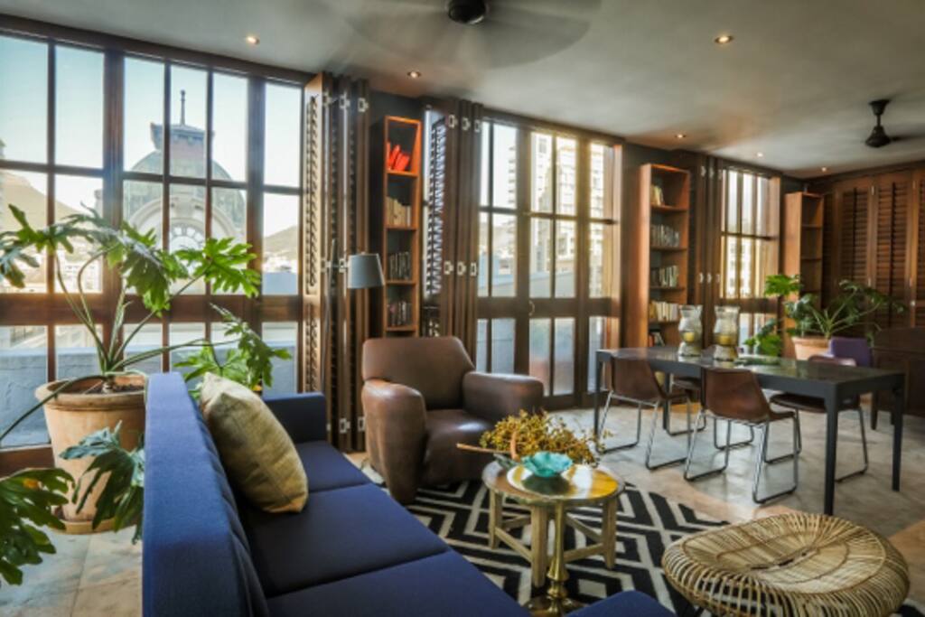 Wrap around views framed by timber louvres. French doors to balcony all round.
