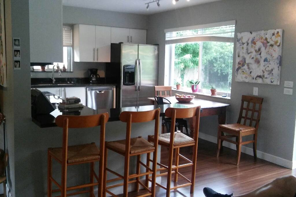 Recently remodeled kitchen has black granite counter tops and breakfast bar. all appliances are stainless steel.