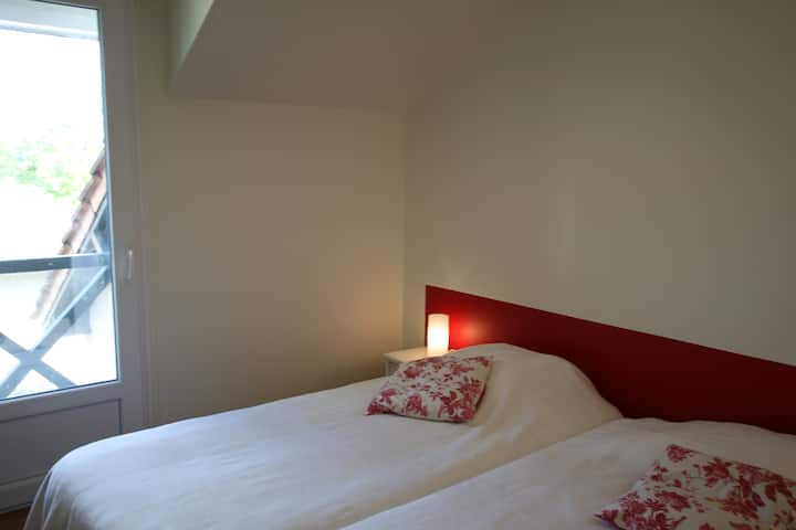 The second bedroom with two single beds. Possibility of making a double bed on request. 