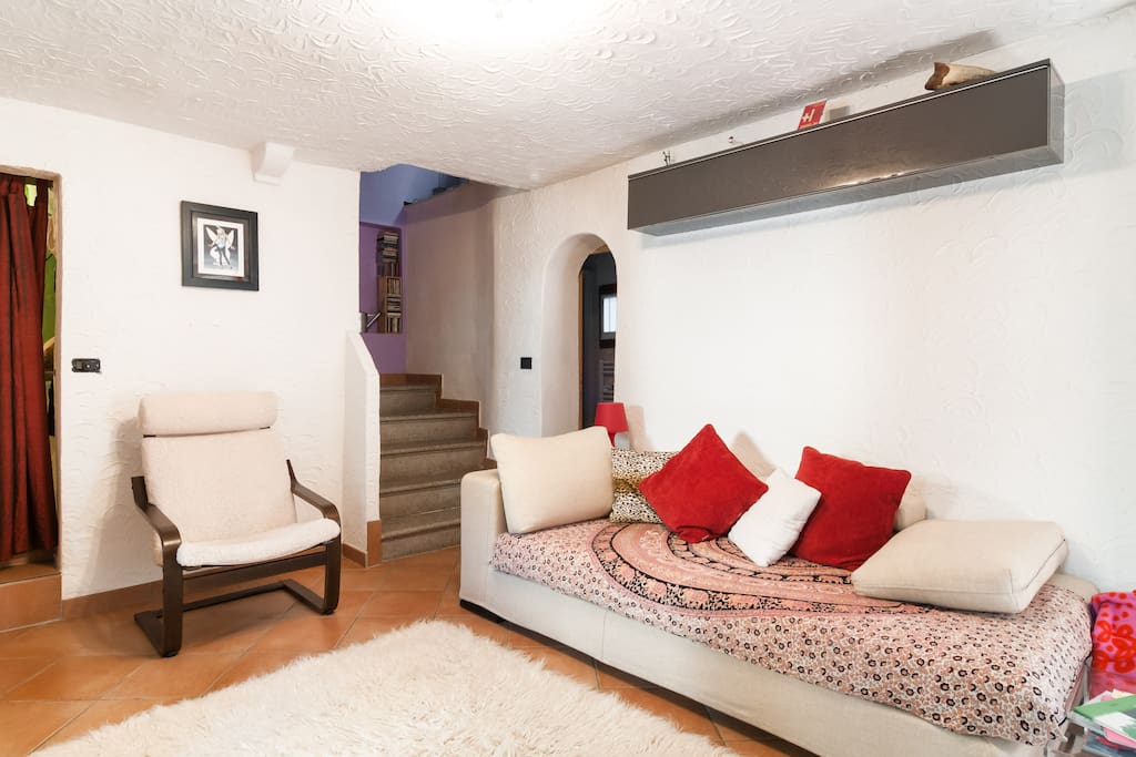 Sofa and door to the shower bath