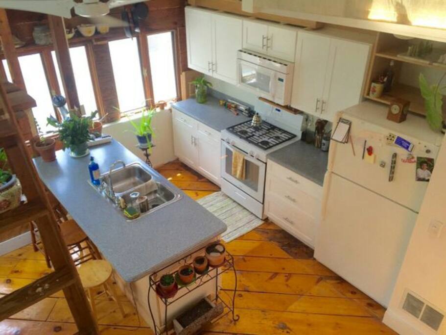 View of fully equipped kitchen from loft.
