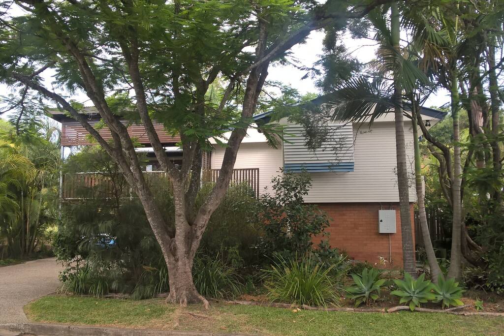 Granny-flat entrance is on the right of the bricked ground floor.