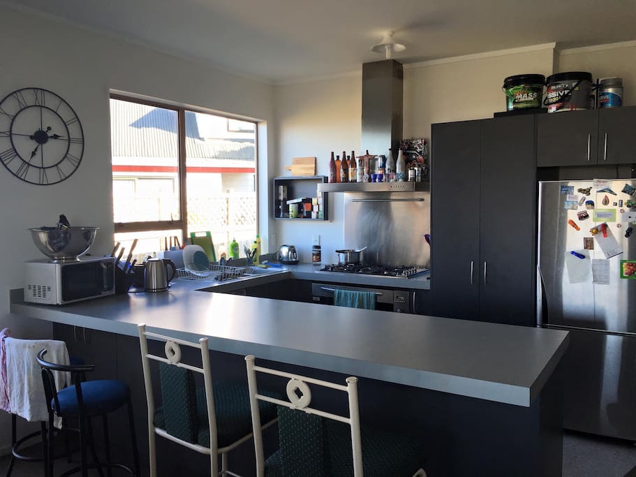 A spacefull kitchen/lounge with all day direct light and a stunning view.