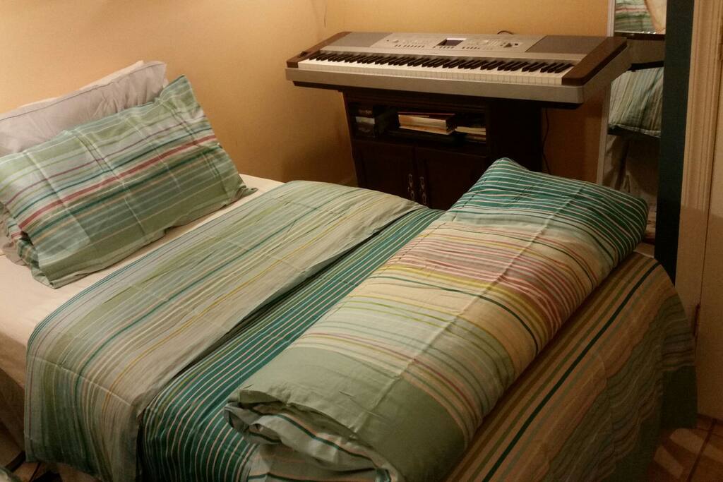 Bed next to keyboard