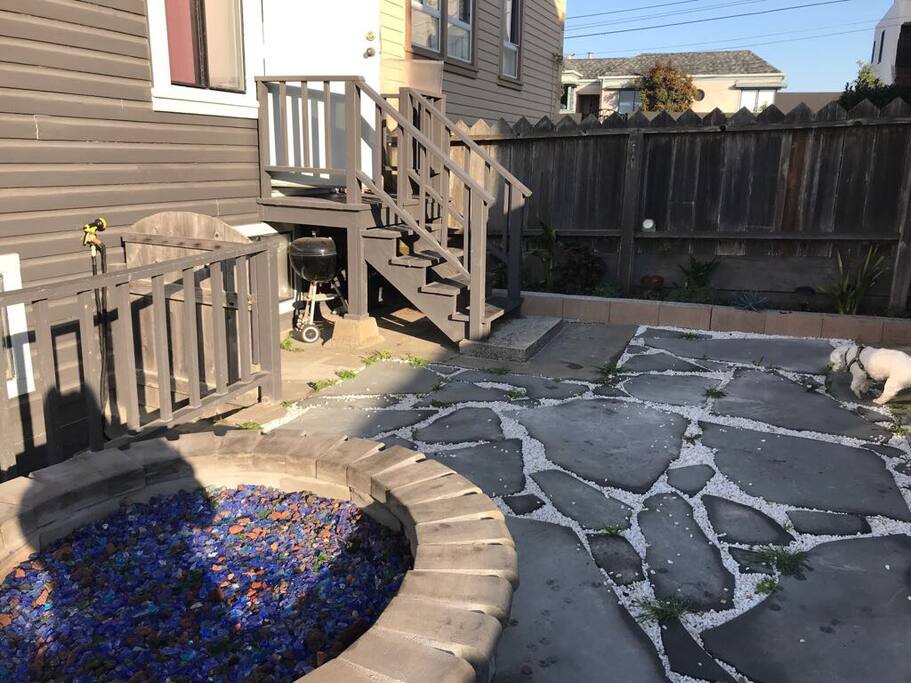 Updated backyard with garden and fire pit for your use.