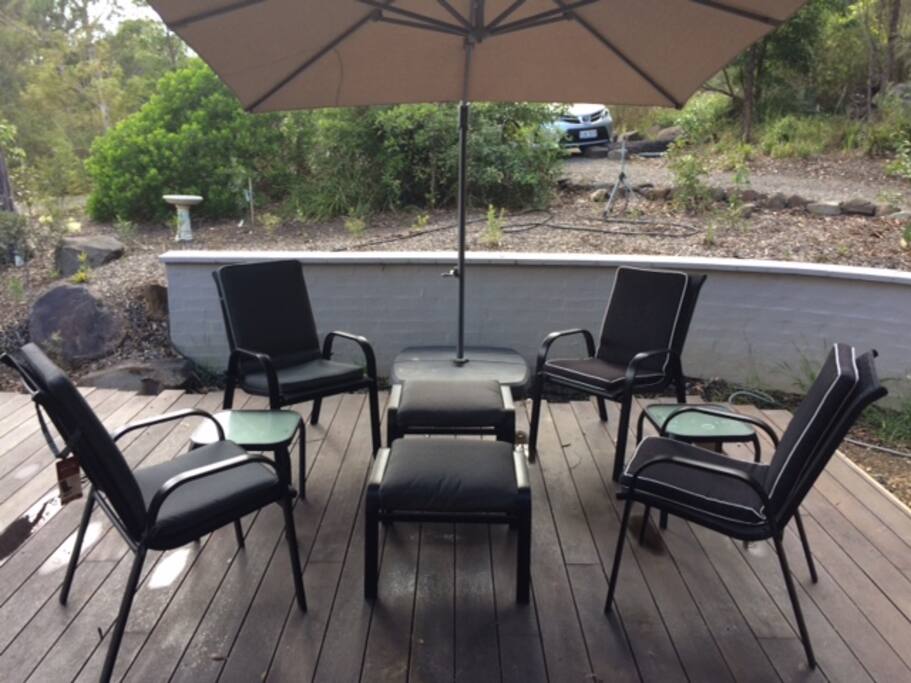 Morning coffee spot on the deck under the opened umbrella.