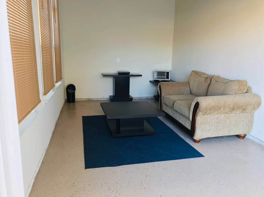 Sofa, Heater, induction heater, center table, blinds and two additional tables