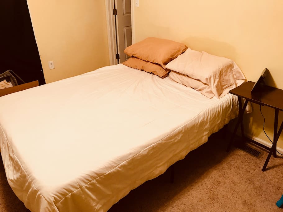 Master Bedroom, memory foam mattress, end table, closet space.