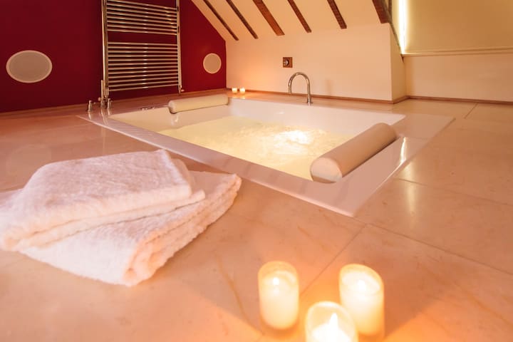 A private guest suite with sunken jacuzzi.