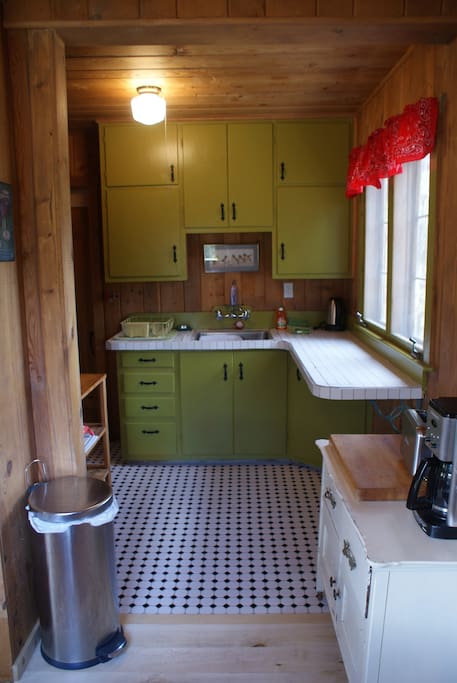 Aspen Wind clean, fully furnished kitchen with stove, refrigerator, microwave, pots, pans, utensils, dishes, coffee maker, toaster...