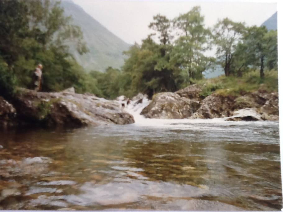 We call this pool the Salmon Pool. The pool is 4 meters deep and makes a wonderful place to swim. You can safely dive off the rocks into the pool and swim up under the waterfall! This pool is a 10 minute walk up river from the cottage