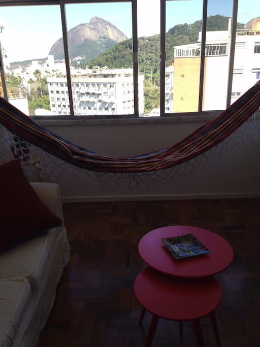 inviting hammock in spacious living room with view to Ipanema and the Atlantic Rainforest