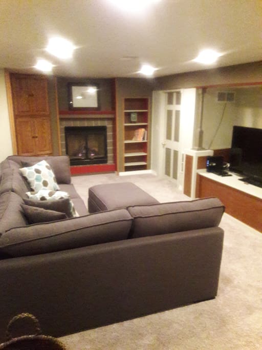 Basement Living Room. TV and gas fireplace.