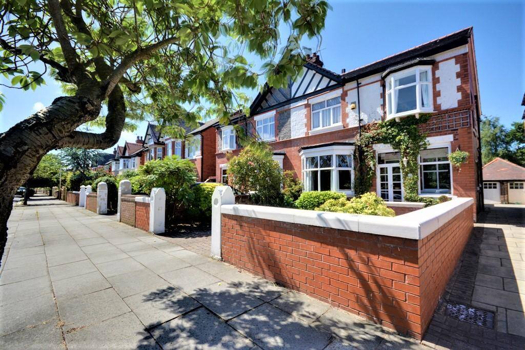 Front of house with space for two cars