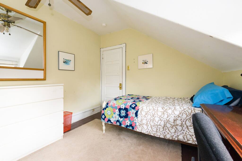 Dresser and ceiling fan.