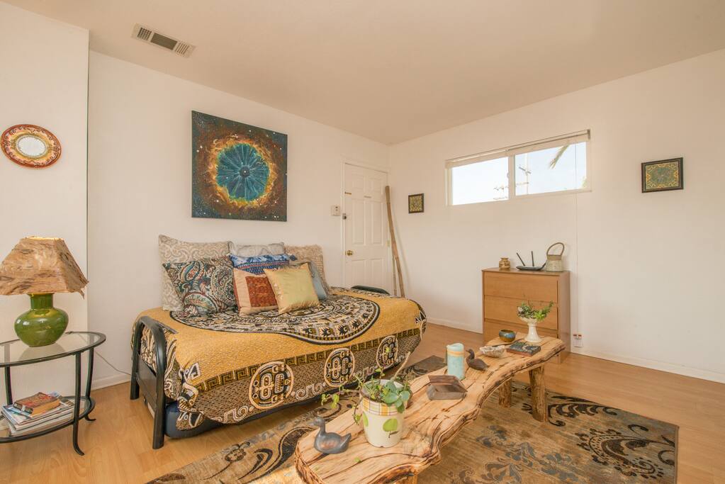 Full Bed - hand carved table - San Diego artist - bed is a day bed, but also a full bed at same time - we keep an extra matress under for extra guests