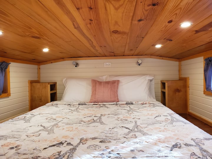 Queen size bed with nightstands on each side. Book reading lights on each side also. 