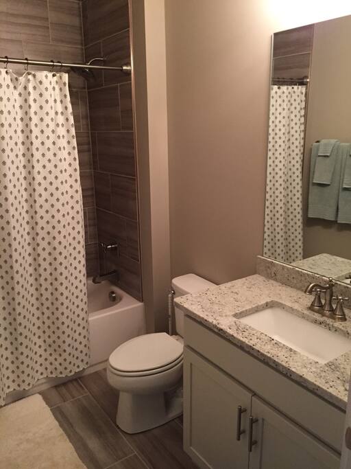 Bathroom adjacent to queen bedroom.