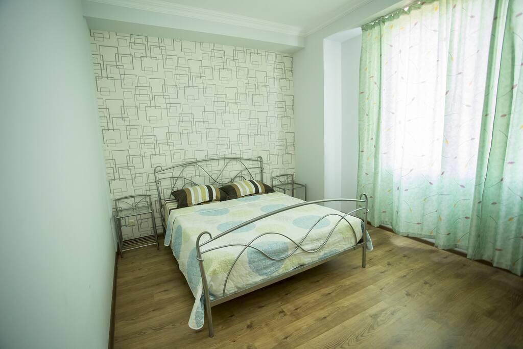 The main bedroom has big windows were you will get a beautiful view on the greenery