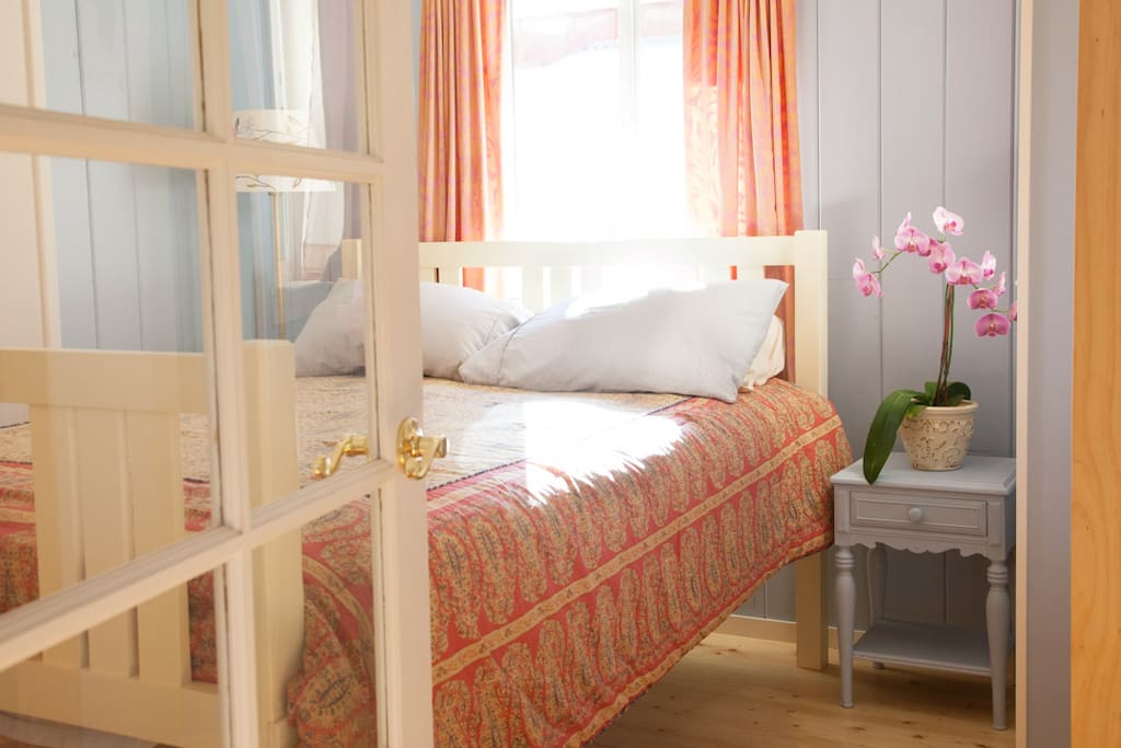 Comfortable queen bed, cotton sheets, down pillows for restful nights.