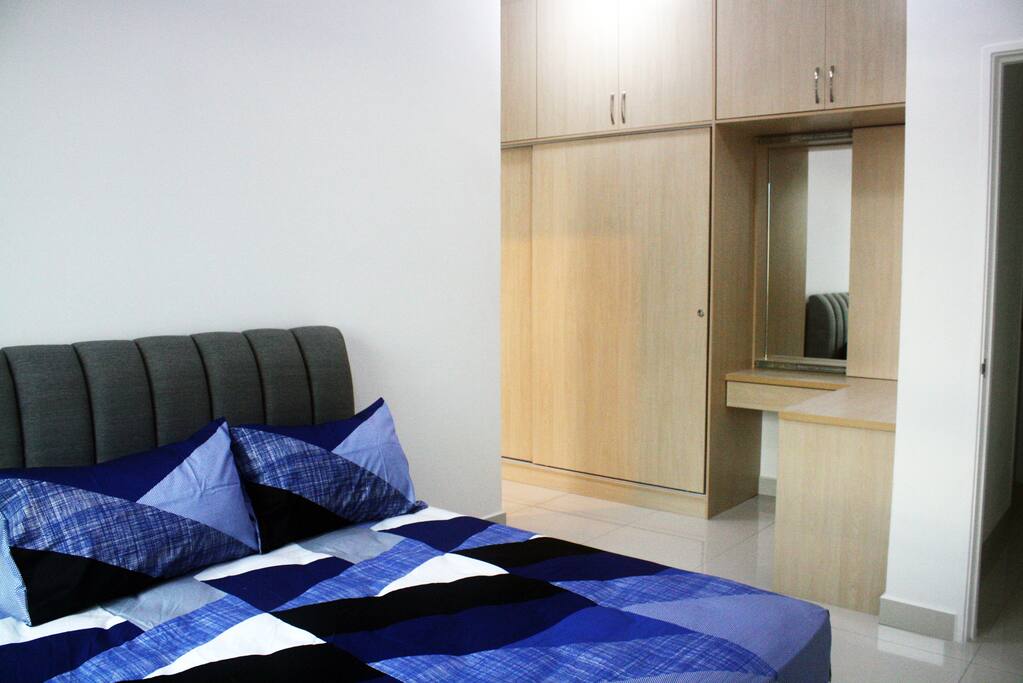 Master room with attached bathroom. King-sized bed.