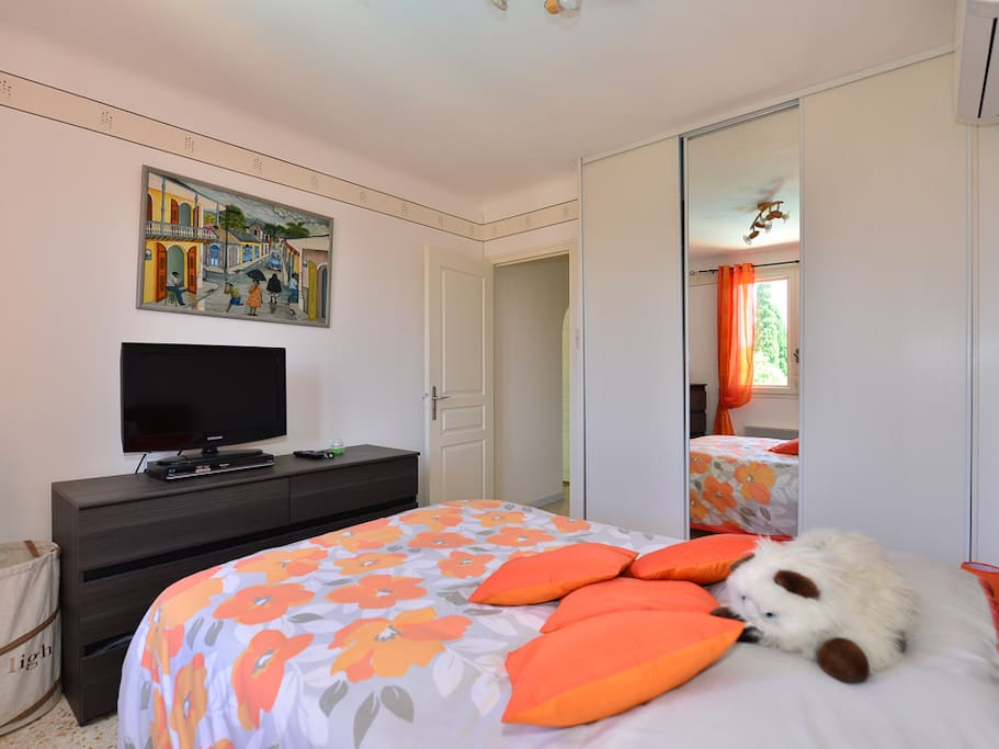 The double bedroom with its large fitted wardrobe, Flat screen TV and DVD player