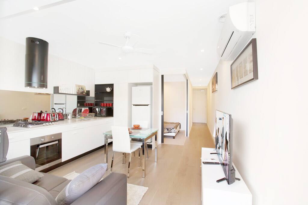 Live in Luxury!
Open area with Large LED TV, Dining Table, and Kitchen with all the Pots and accessories!