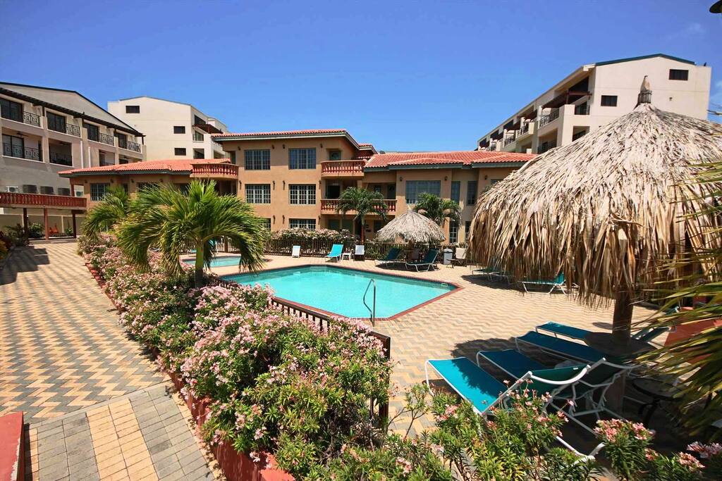 Swimming pool area right in front of your condo!