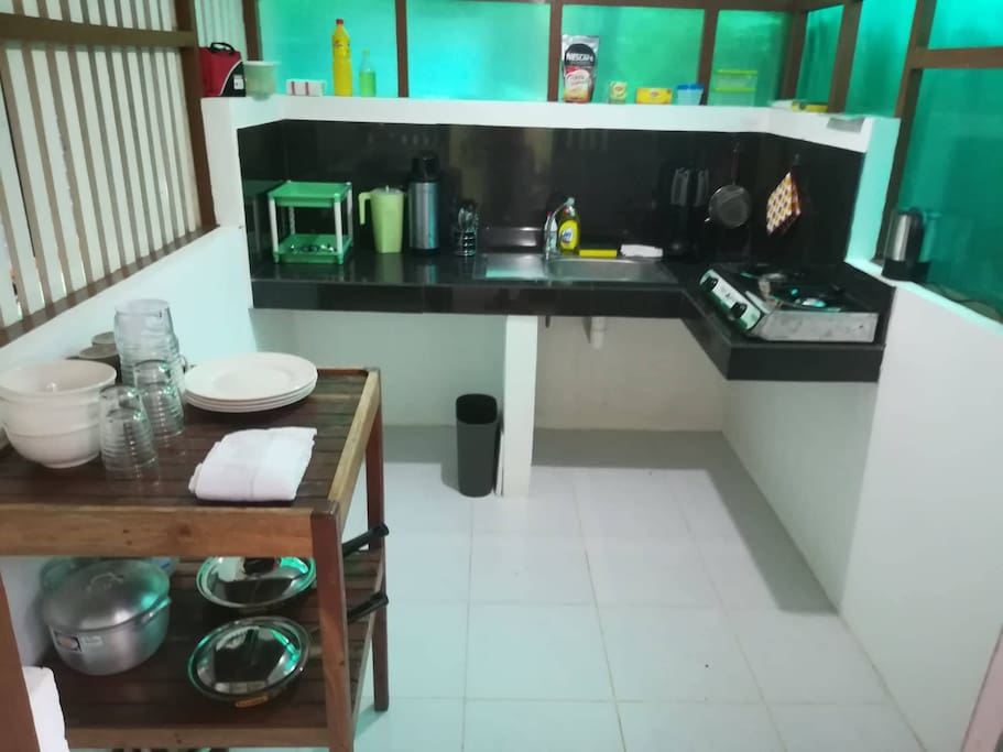 Kitchen is equipped with a gas stove, kettle, pots, pans and utensils. Also, free-flowing coffee and tea.