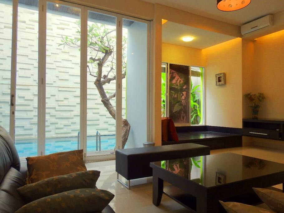 Spacious Living Room with Pool View